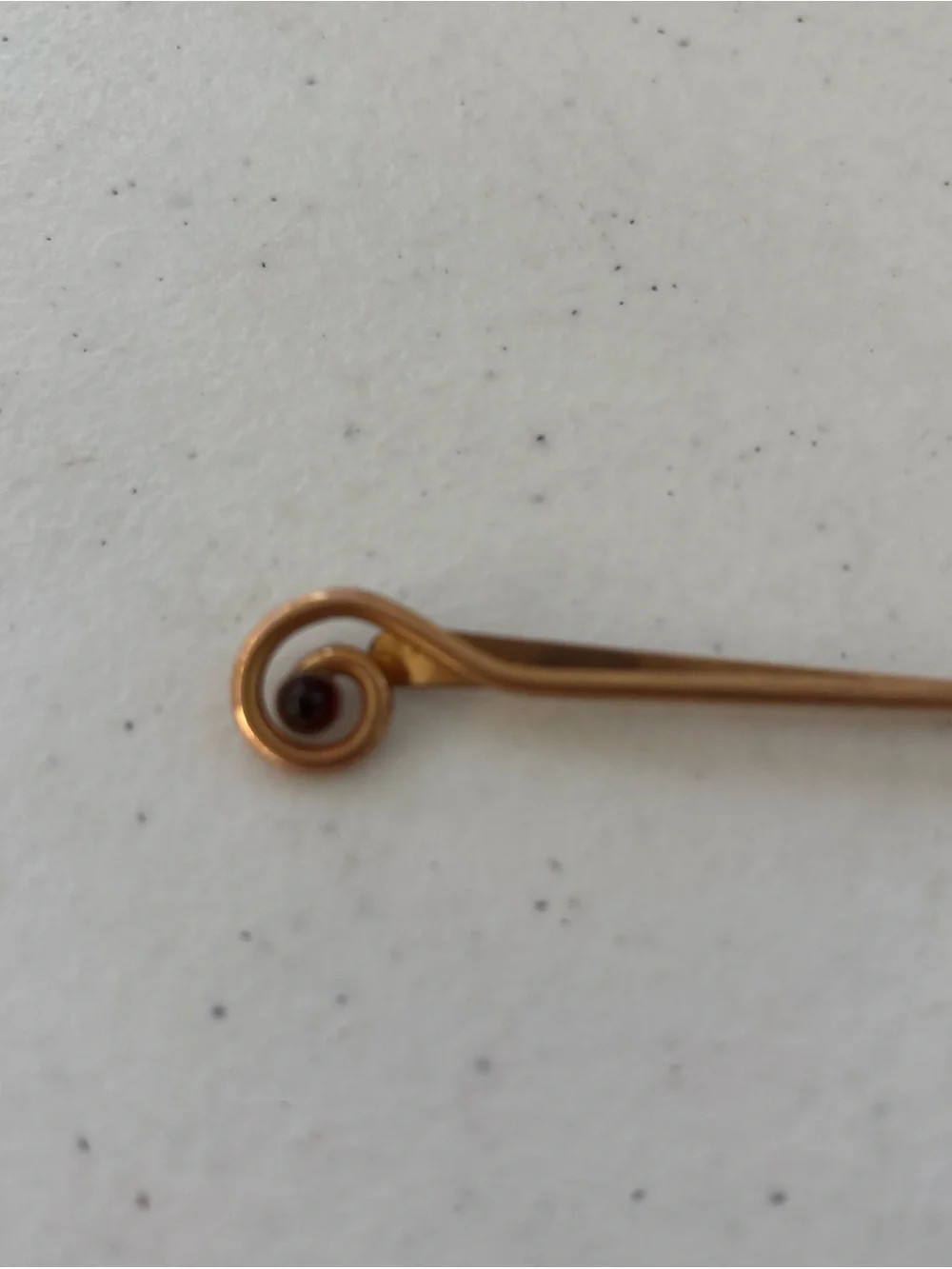 Gold-Tone Spiral Tie Bar with Garnet Accent